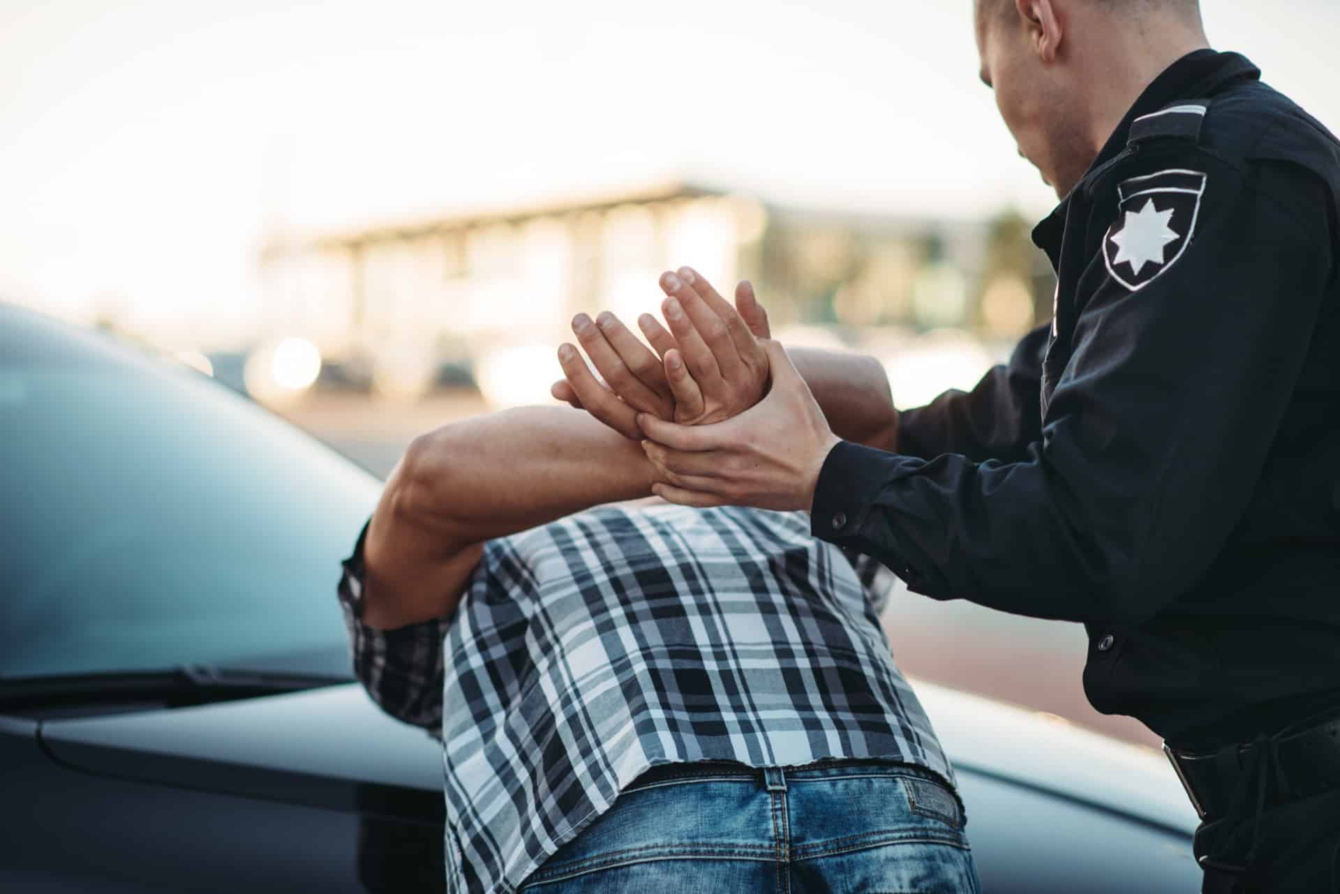 Policeman arresting a man