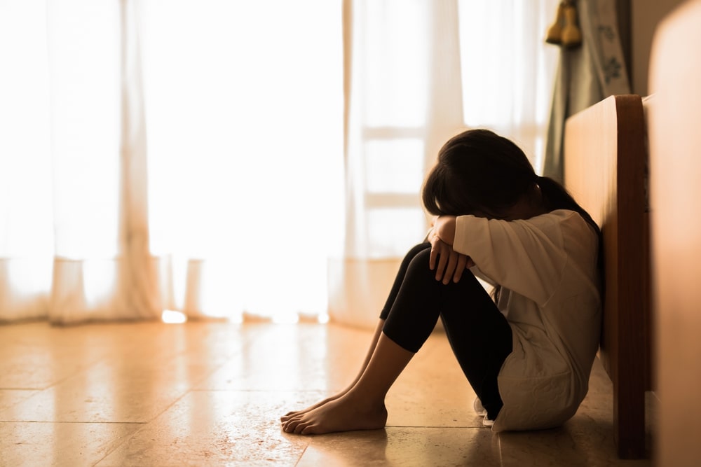 Woman Crying Sitting On The Floor